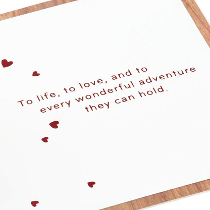 Hallmark Signature Paper Wonder Wood Pop Up Anniversary Card with heartfelt message and red hearts design on a white background.