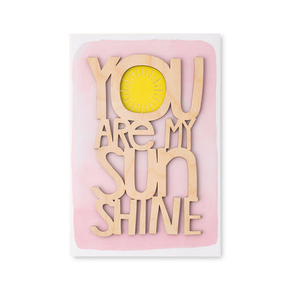 Hallmark Signature Mother's Day Card - You Are My Sunshine with wooden lettering and yellow sun detail against a pink watercolour background.