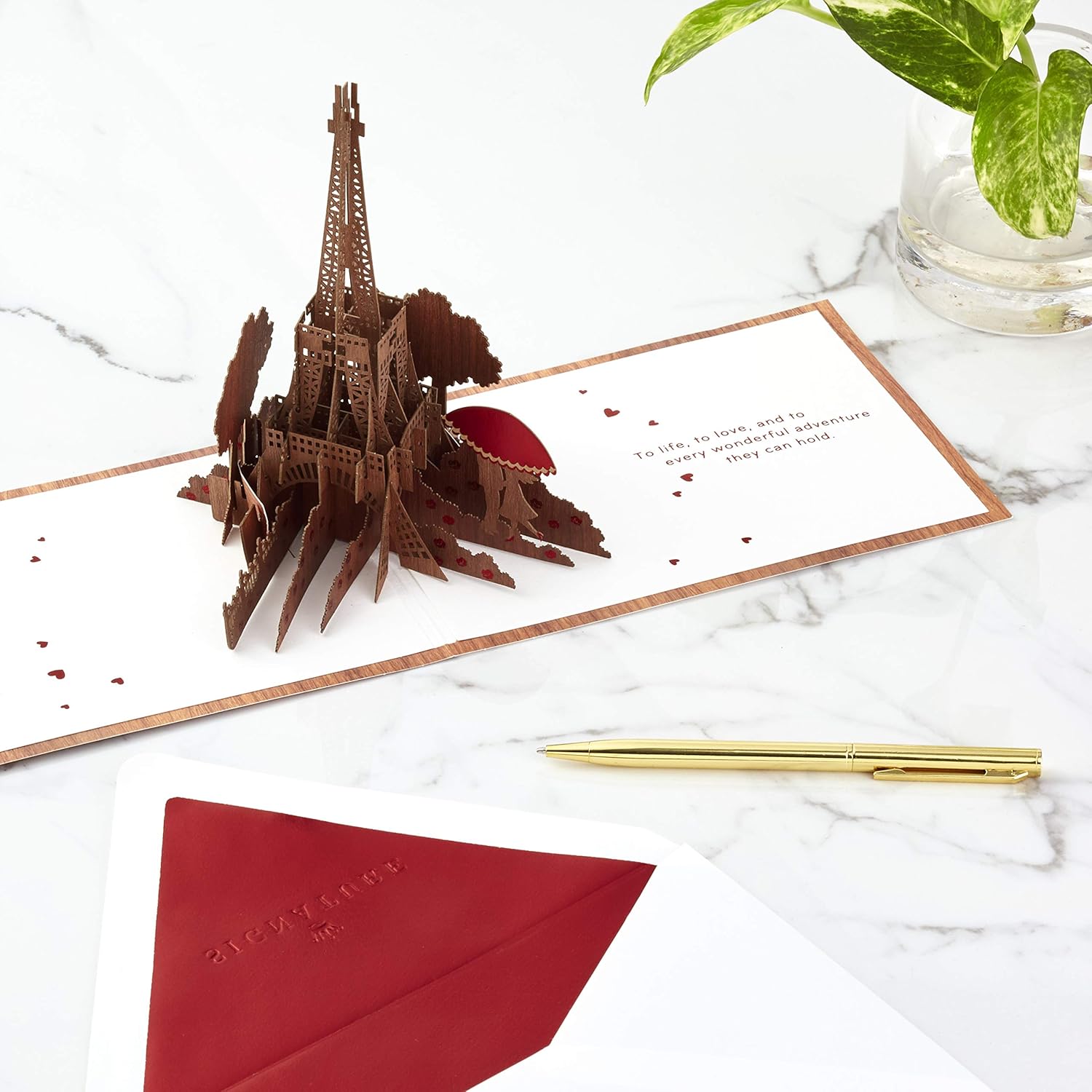Hallmark Signature Paper Wonder Wood Pop Up Anniversary Card, romantic birthday card with Eiffel Tower pop-up detail on marble surface.