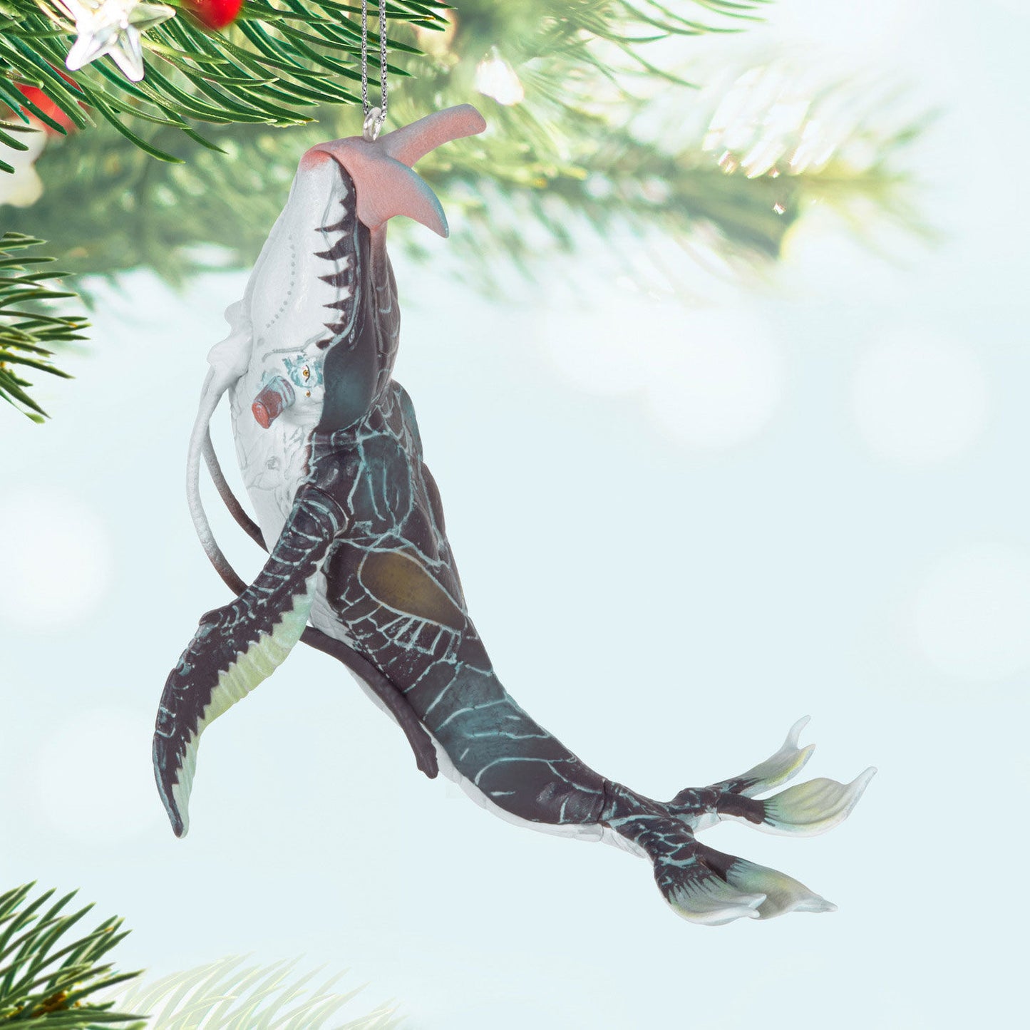Avatar: The Way of Water Payakan the Tulkun — Hallmark Keepsake Christmas Ornament hanging on a pine tree branch, showcasing intricate details.