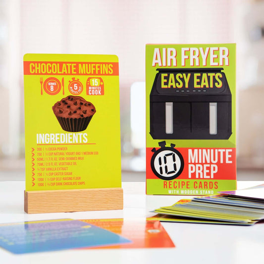 Easy Eats Air Fryer Recipe Cards displayed with a wooden stand, featuring a chocolate muffins recipe and prep time details.