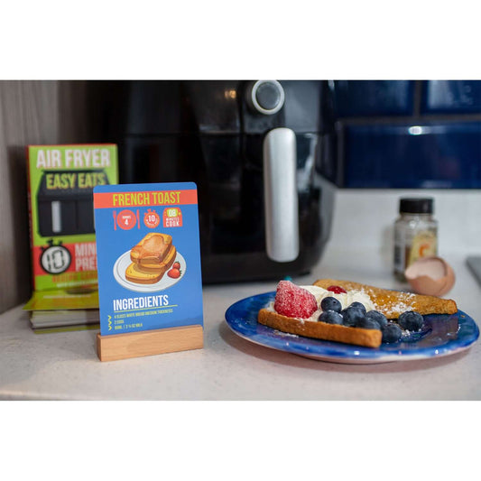 Easy Eats Air Fryer Recipe Cards featuring French toast recipe on display, with a plate of berries and toast beside an air fryer.