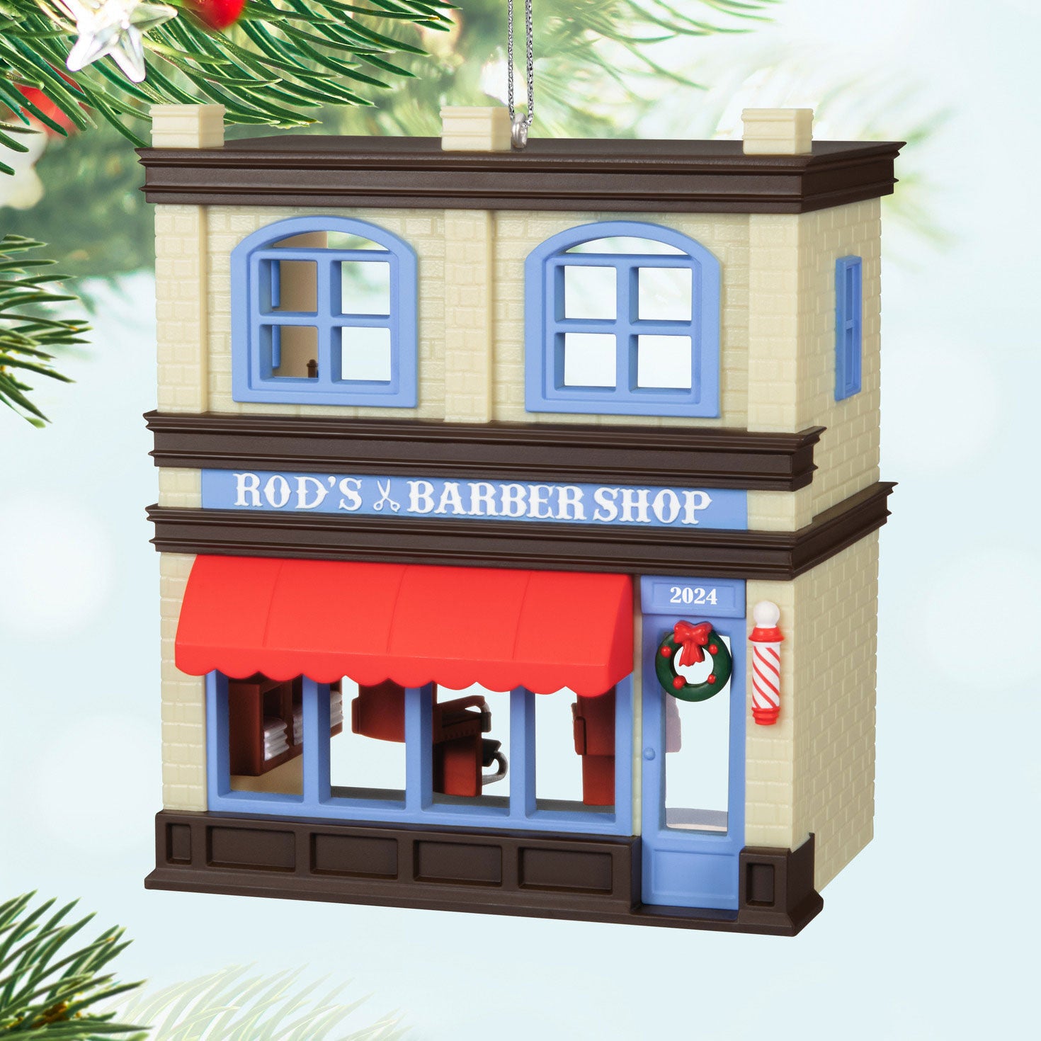 Nostalgic Houses and Shops Rod's Barbershop — Hallmark Keepsake Christmas Ornament, decorative barbershop façade, vibrant red awning, detailed exterior.