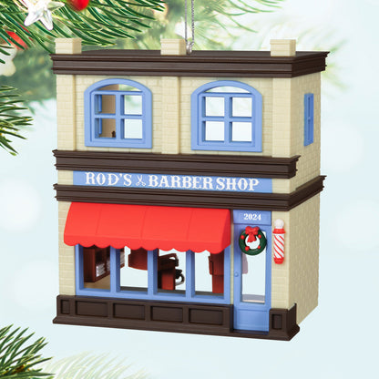 Nostalgic Houses and Shops Rod's Barbershop — Hallmark Keepsake Christmas Ornament, decorative barbershop façade, vibrant red awning, detailed exterior.