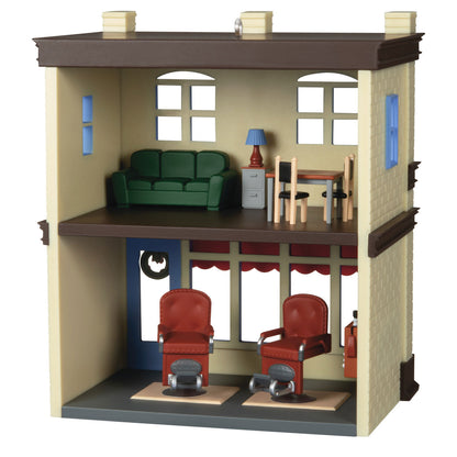 Nostalgic Houses and Shops Rod's Barbershop — Hallmark Keepsake Christmas Ornament, detailed interior with vintage barber chairs and living space.