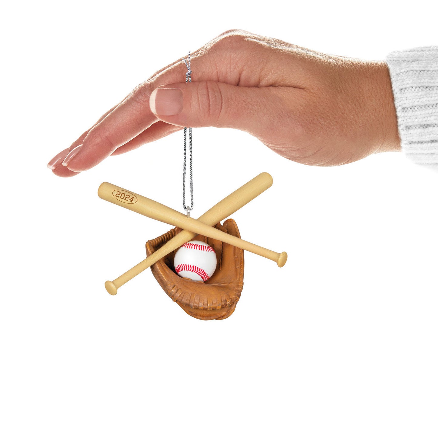 Baseball Star — Hallmark Keepsake Christmas Ornament held in hand, featuring a baseball, catcher's mitt, and crossed bats in a close-up view.