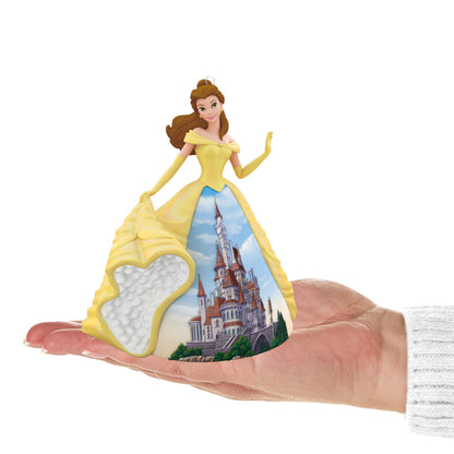Disney Princess, Celebration Belle (Porcelain) — Hallmark Keepsake Christmas Ornament in hand, featuring vibrant yellow dress and Beast's castle scene.