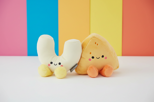 Mac & Cheese, Magnetic Plush Pair - Better Together displayed against a colourful background, featuring a macaroni and cheese-shaped plush.