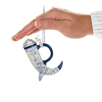 Beer stein — Hallmark Keepsake Christmas Ornament held in hand, featuring a blue and white cornucopia design with an elegant lid.