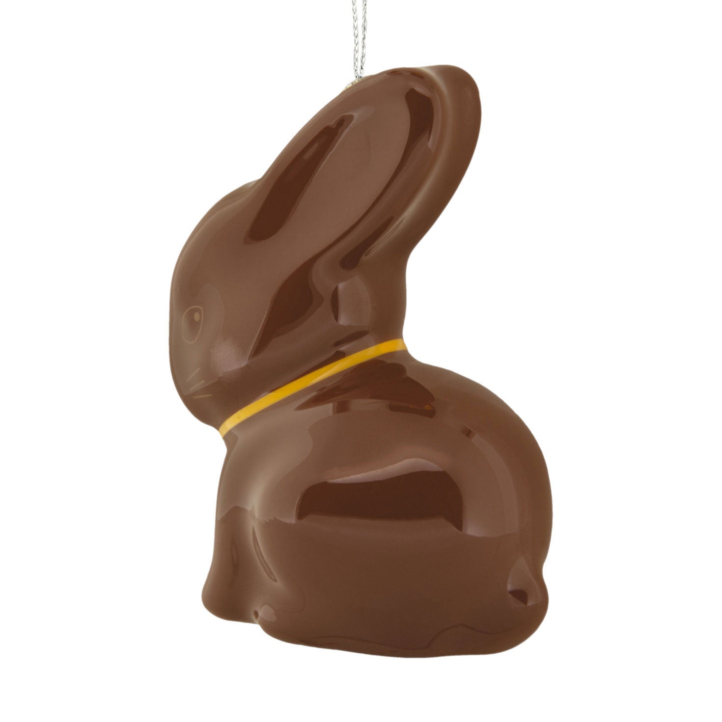 Chocolate bunny with a yellow ribbon on a white background