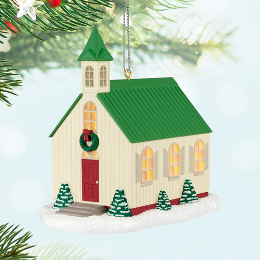 The Light of Hope — Hallmark Keepsake Christmas Ornament features a charming church with a green roof and red door, dusted with snow.