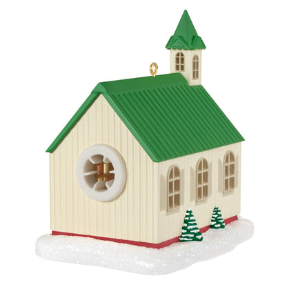 The Light of Hope — Hallmark Keepsake Christmas Ornament, church design, green roof, angled view with snowy base.