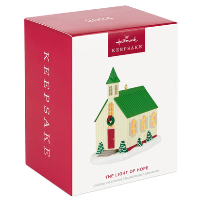 The Light of Hope — Hallmark Keepsake Christmas Ornament in festive packaging featuring a church model with a green roof.
