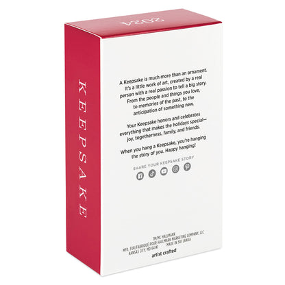 Hallmark Keepsake Christmas ornament packaging, featuring a red and white design with a message about the importance of keepsakes.