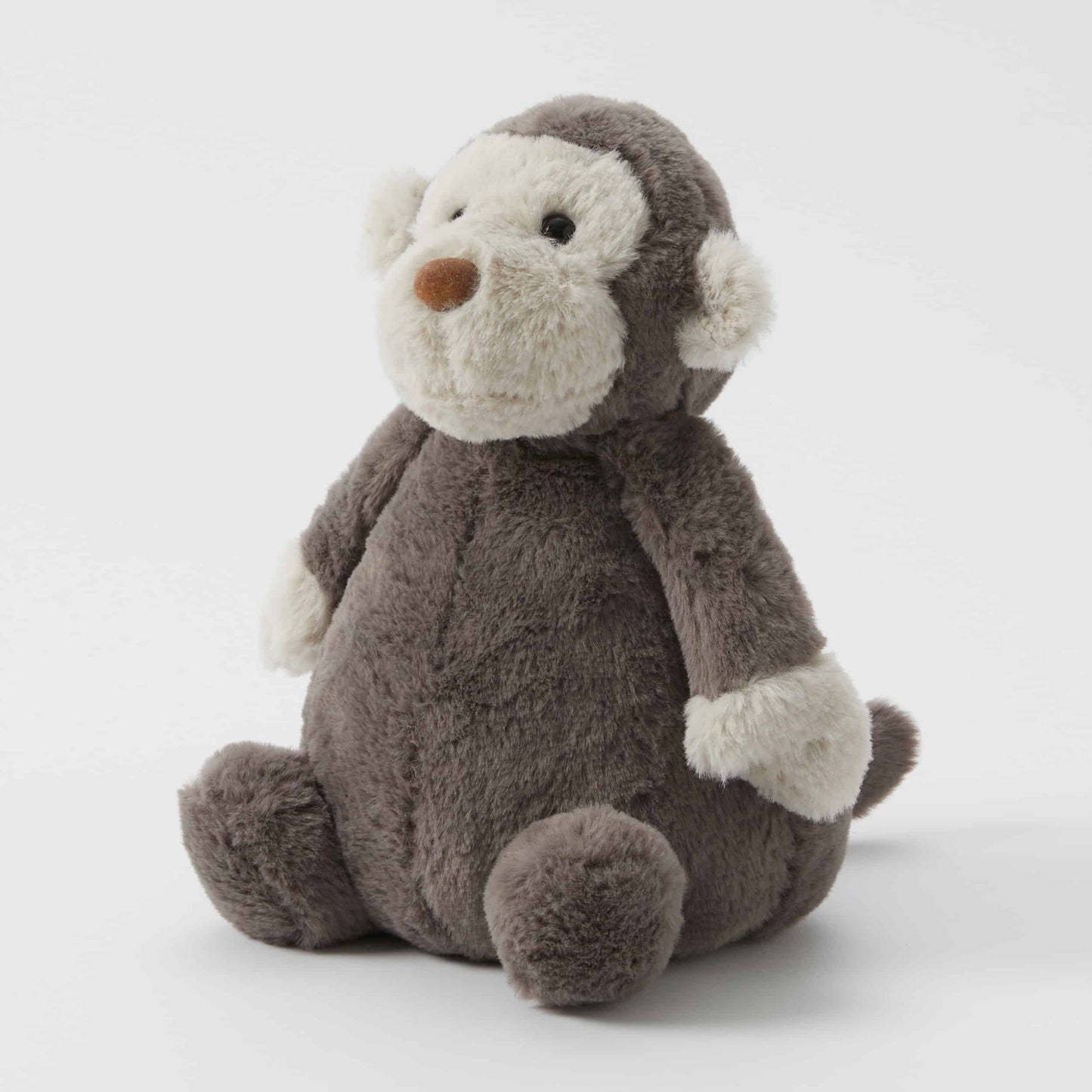 Jojo the Monkey - Plush Toy in a seated position, made from ultra-plush grey fabric with soft cream accents.