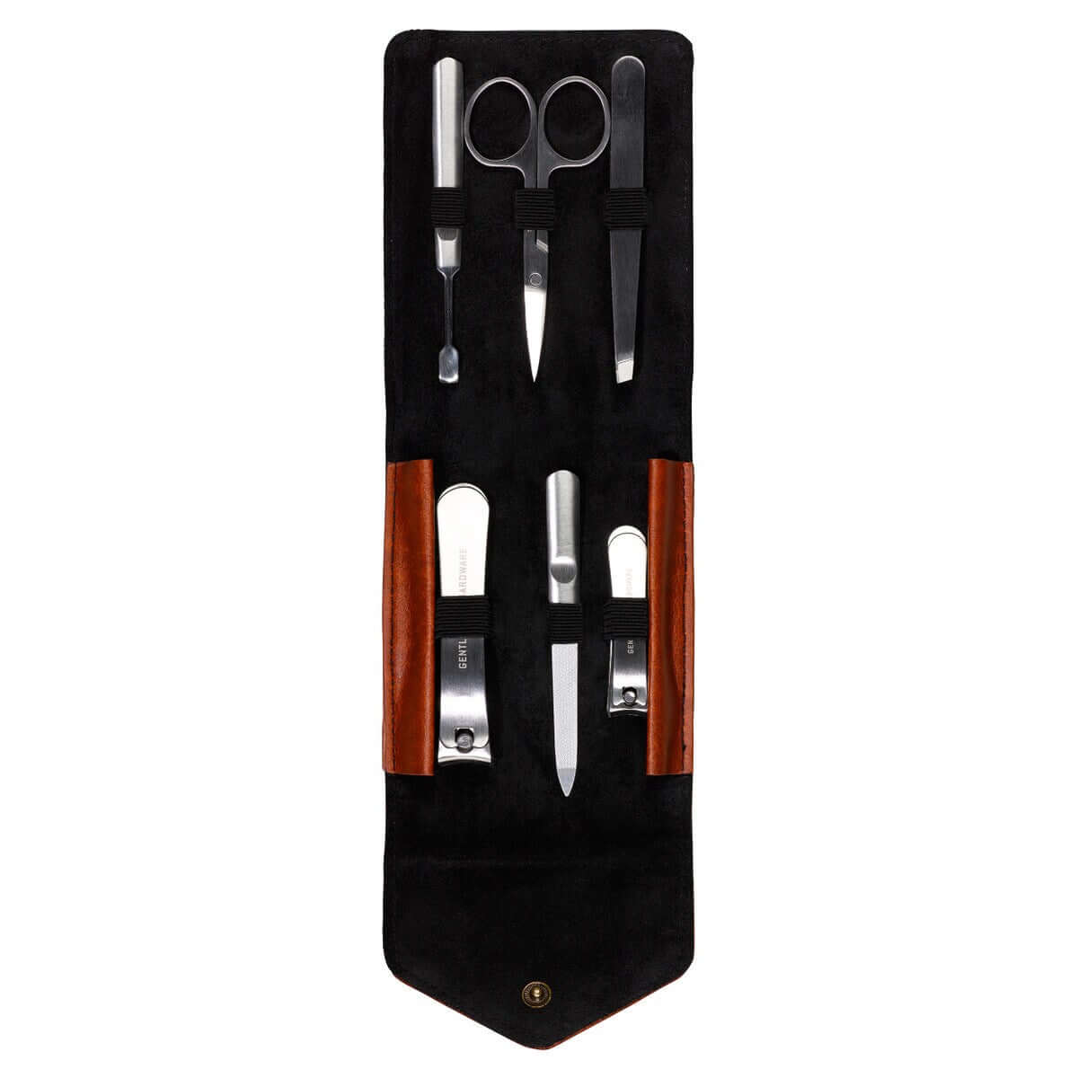 Charcoal Canvas Manicure Set featuring stainless steel tools in a black wax-canvas case with leather accents, flat lay view.
