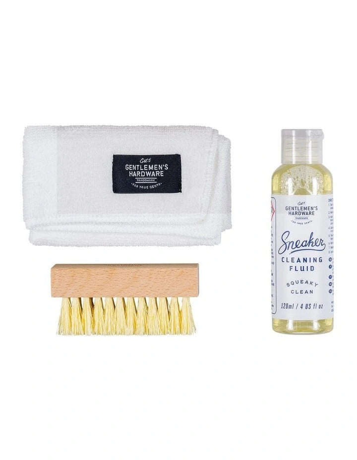 Sneaker cleaning kit including cleaning fluid, brush and cloth; displayed on a white background for clarity.