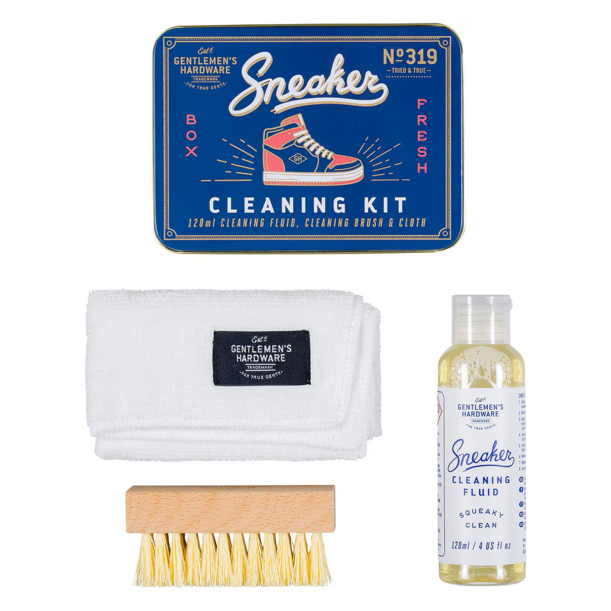 Sneaker cleaning kit, includes cleaning fluid, brush, cloth, and gift tin, flat lay display.