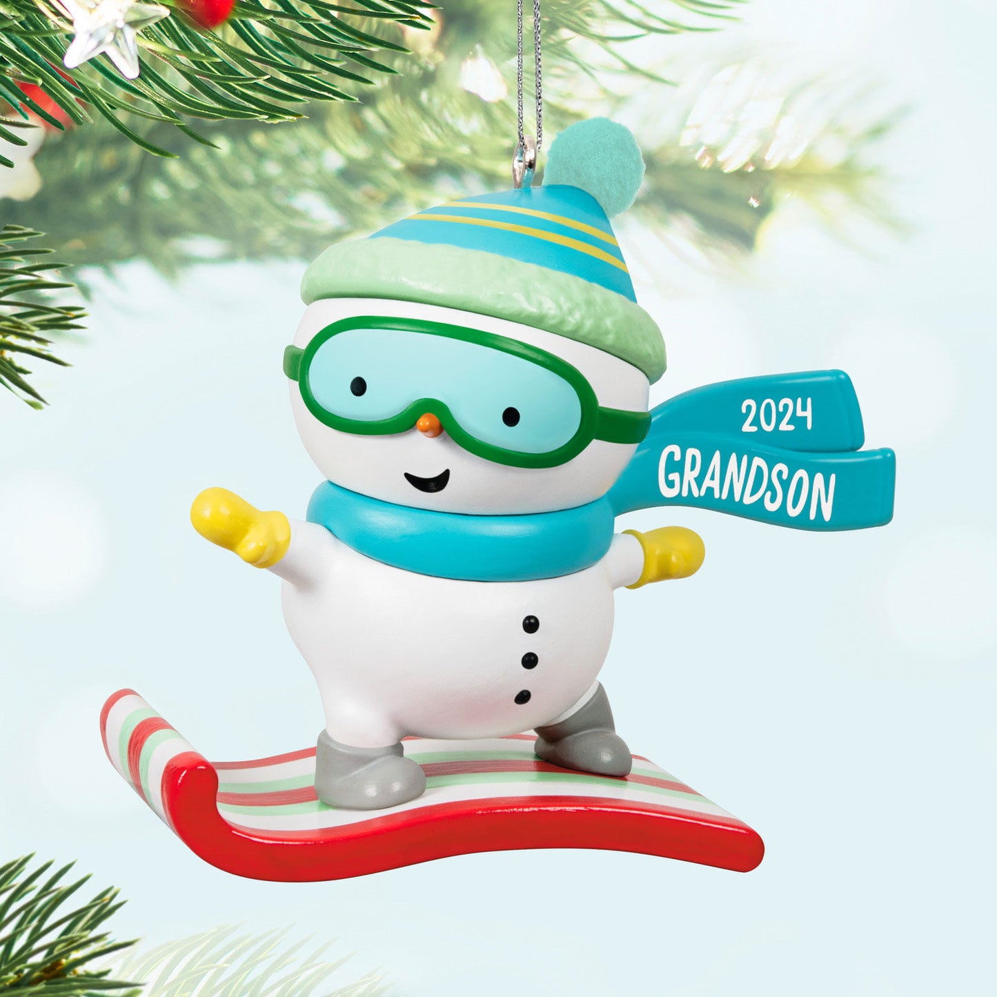 Grandson Snowboarding Snowman — Hallmark Keepsake Christmas Ornament, plastic ornament with teal and green details, featuring the year 2024.