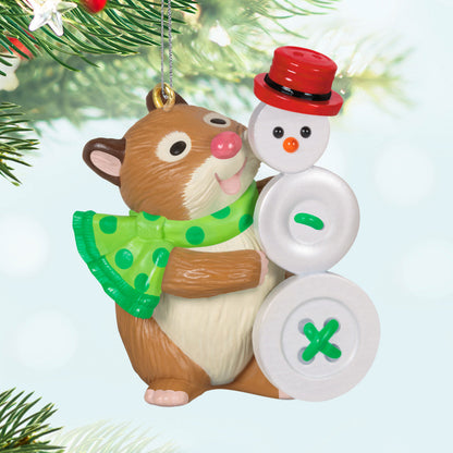 Cute as a Button — Hallmark Keepsake Christmas Ornament featuring a happy hamster in a green polka dot scarf beside a button snowman, flat lay view.