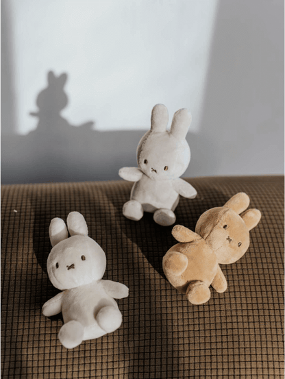 Lucky Miffy Sitting Grey in giftbox - 10 cm - 4" plush toys in beige, grey, and brown, displayed on a textured surface with shadows.