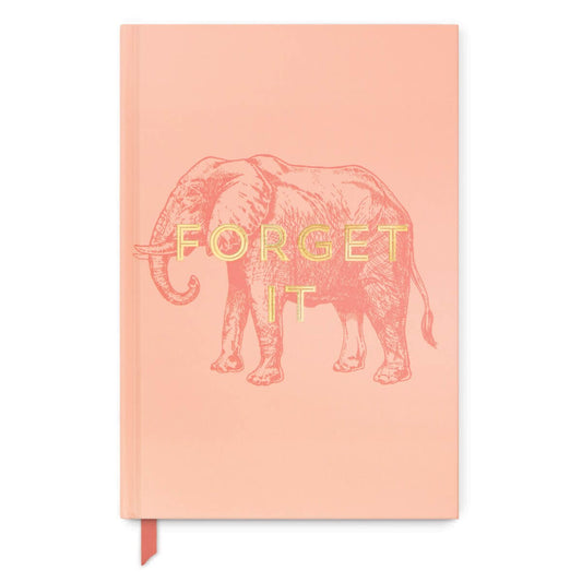 Forget It Journal (A5) in soft coral colour featuring an elephant illustration and metallic gold text, with a fabric bookmark.