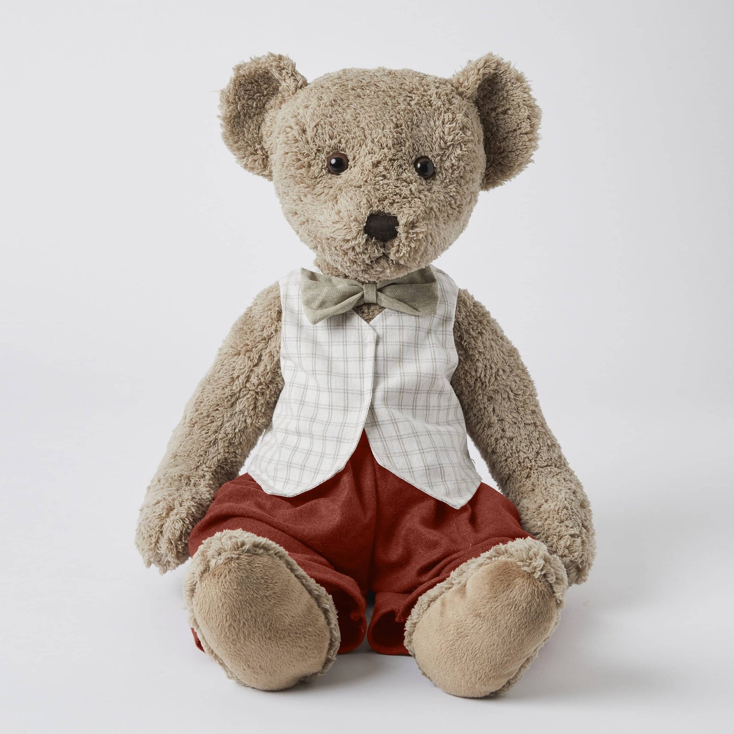 Wilbur the Notting Hill Bear, plush toy with check vest and rust pants, seated view, 30 cm tall, soft faux fur.
