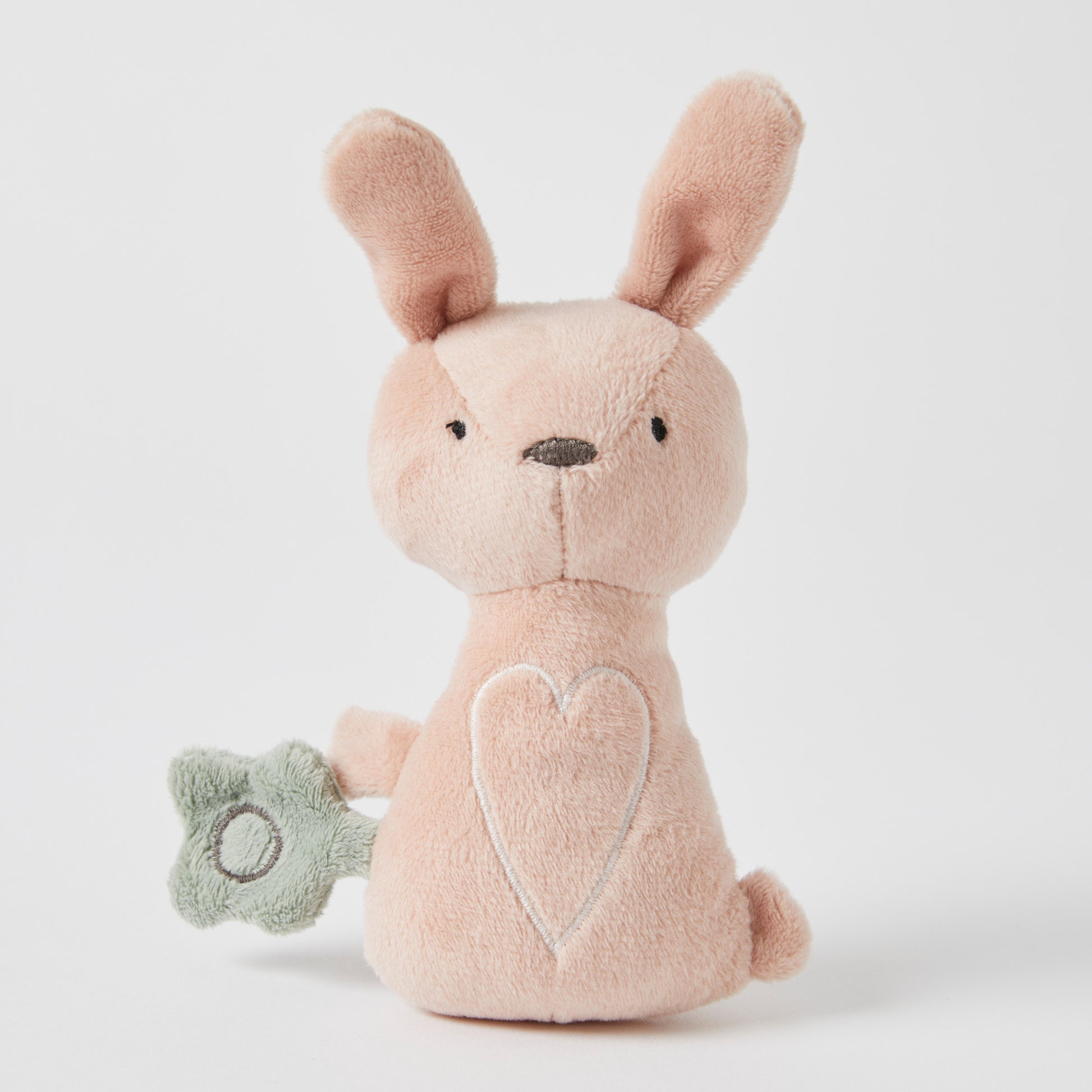 Freya Plush Bunny Rattle, soft plush toy in pink with a green sensory attachment, showcasing a heart design.