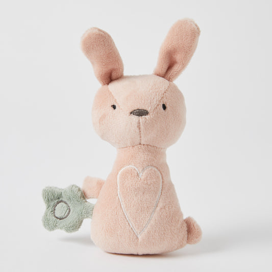 Freya Plush Bunny Rattle, soft plush toy in pink with a green sensory attachment, showcasing a heart design.