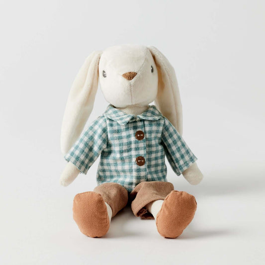 Huey the Bunny soft toy in checked shirt and brown pants, sitting down with floppy ears, ideal for cuddling.