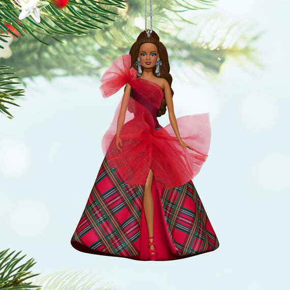 Latina Holiday Barbie™ Hallmark — Hallmark Keepsake Christmas Ornament in festive red dress with plaid pattern, hanging from tree branches.