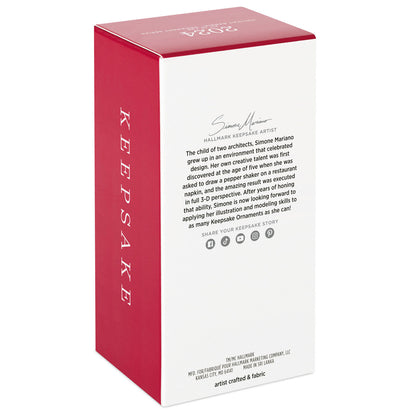 Latina Holiday Barbie™ Hallmark — Hallmark Keepsake Christmas Ornament packaging featuring artist Simone Mariano’s biography and details.