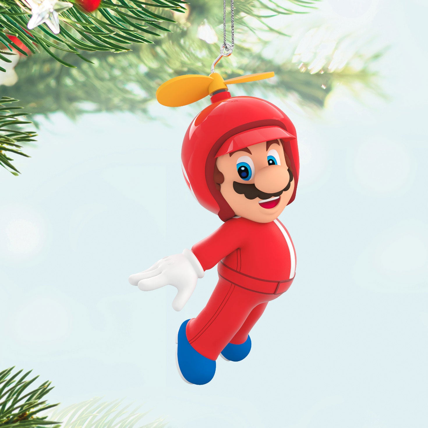 Nintendo Super Mario™ Powered Up With Mario Propeller Mario — Hallmark Keepsake Christmas Ornament, bright red decoration, flying pose against tree branches.
