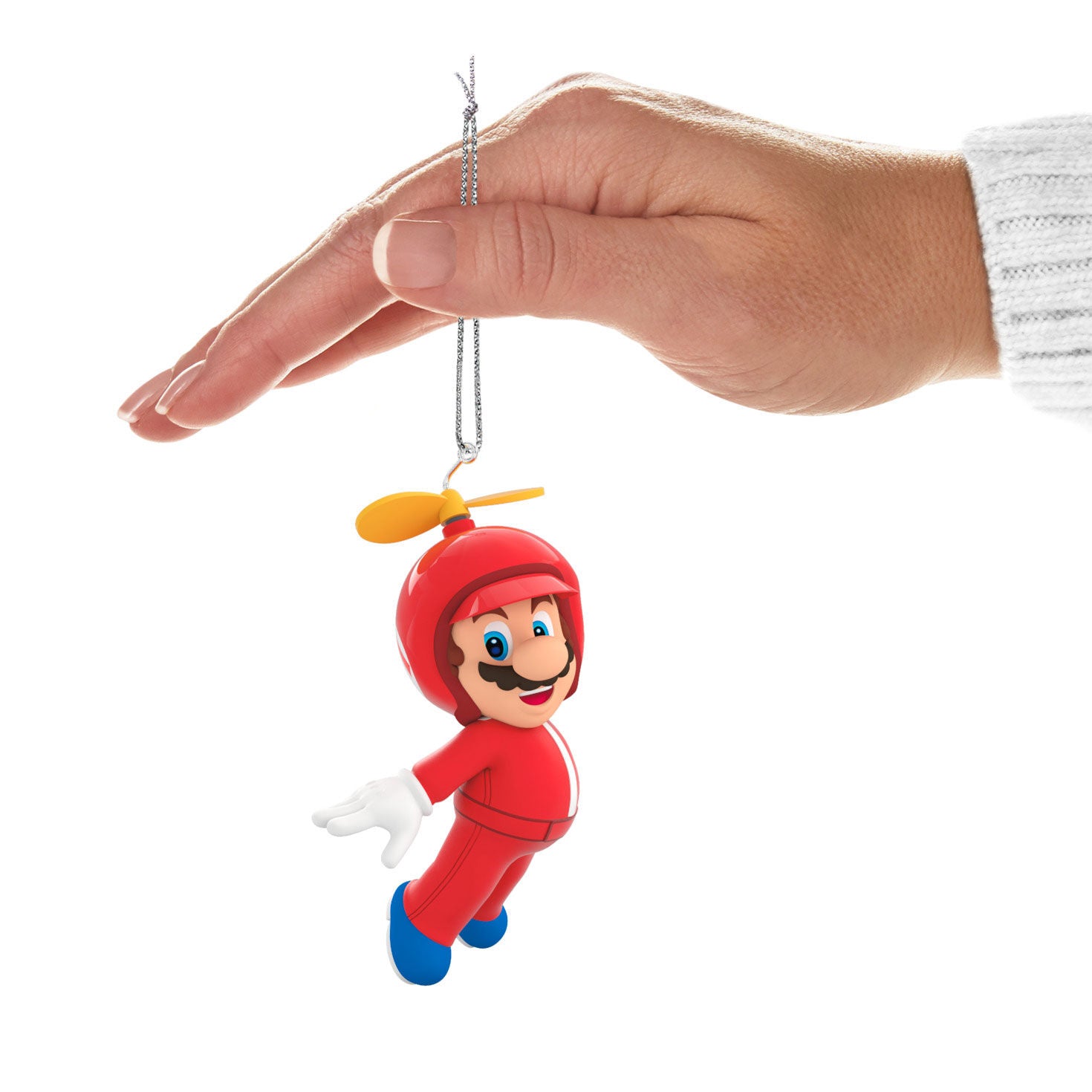 Nintendo Super Mario™ Powered Up With Mario Propeller Mario — Hallmark Keepsake Christmas Ornament held in hand with a smiling face and propeller detail.