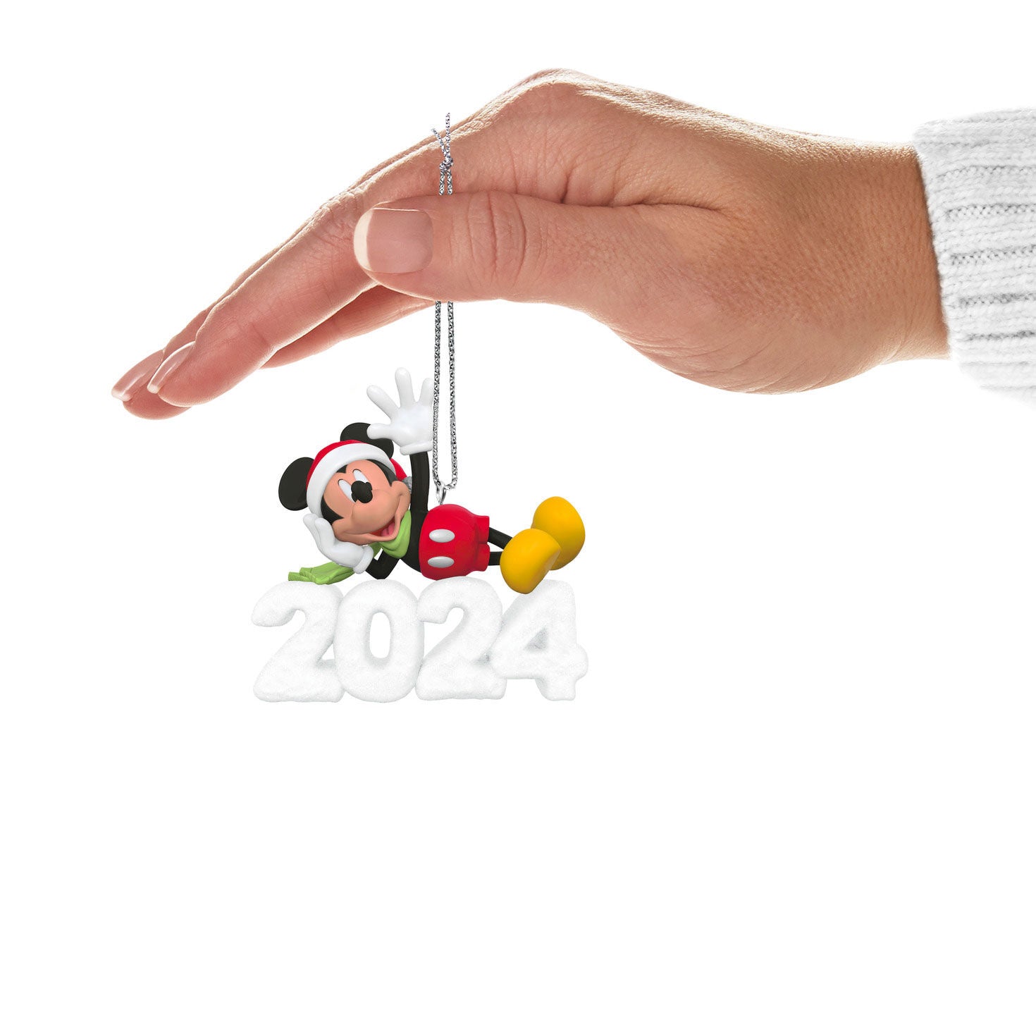 Disney Mickey Mouse, A Year of Disney Magic — Hallmark Keepsake Christmas Ornament held in hand, featuring 2024 snow sculpture and festive design.