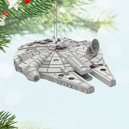 Star Wars™ Millennium Falcon™ (Miniature) — Hallmark Keepsake Christmas Ornament hanging from a Christmas tree branch with festive backdrop.