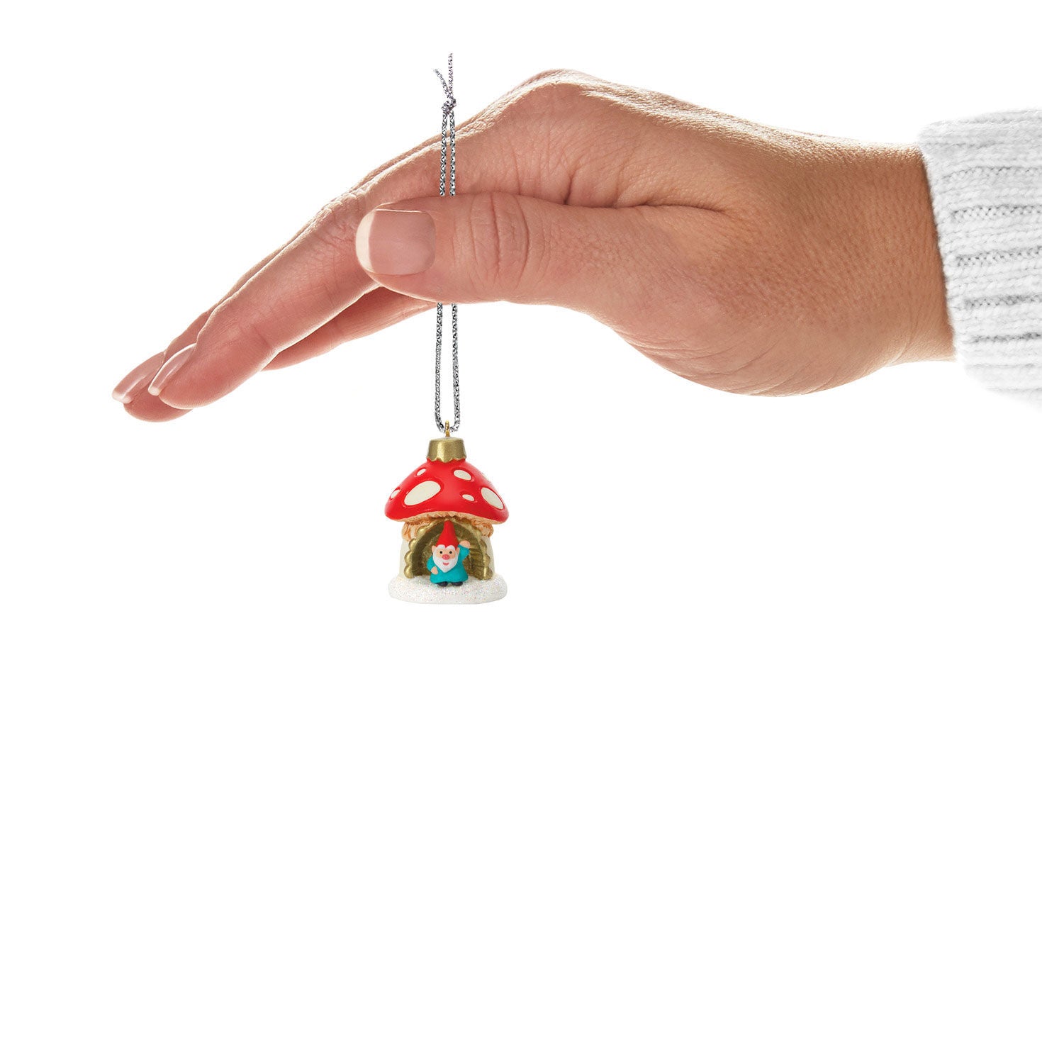 A World Within (Miniature) — Hallmark Keepsake Christmas Ornament, plastic design, featuring a gnome in a mushroom hut, held in a hand.