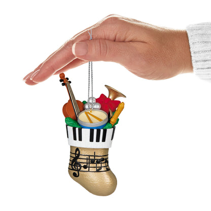 Stocking Stuffers — Hallmark Keepsake Christmas Ornament hand-held view featuring a musical-themed stocking filled with instruments.