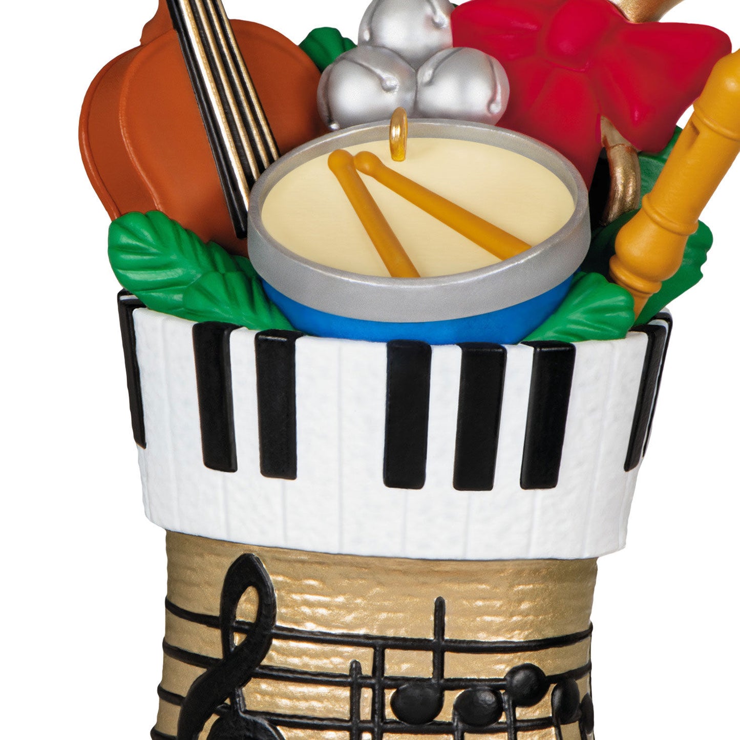Stocking Stuffers — Hallmark Keepsake Christmas Ornament, festive gold stocking filled with musical instruments, close-up detail of contents.