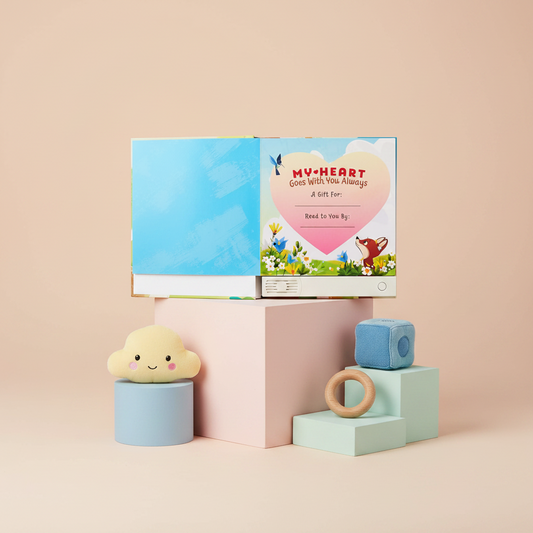 Children's book titled 'My Heart Goes with You Always' on a pink background with toys around.