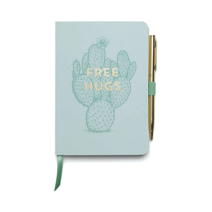 Vintage Sass Notebook with Pen - Free Hugs in soft touch blue cover featuring cactus illustration and gold lettering, flat lay view.