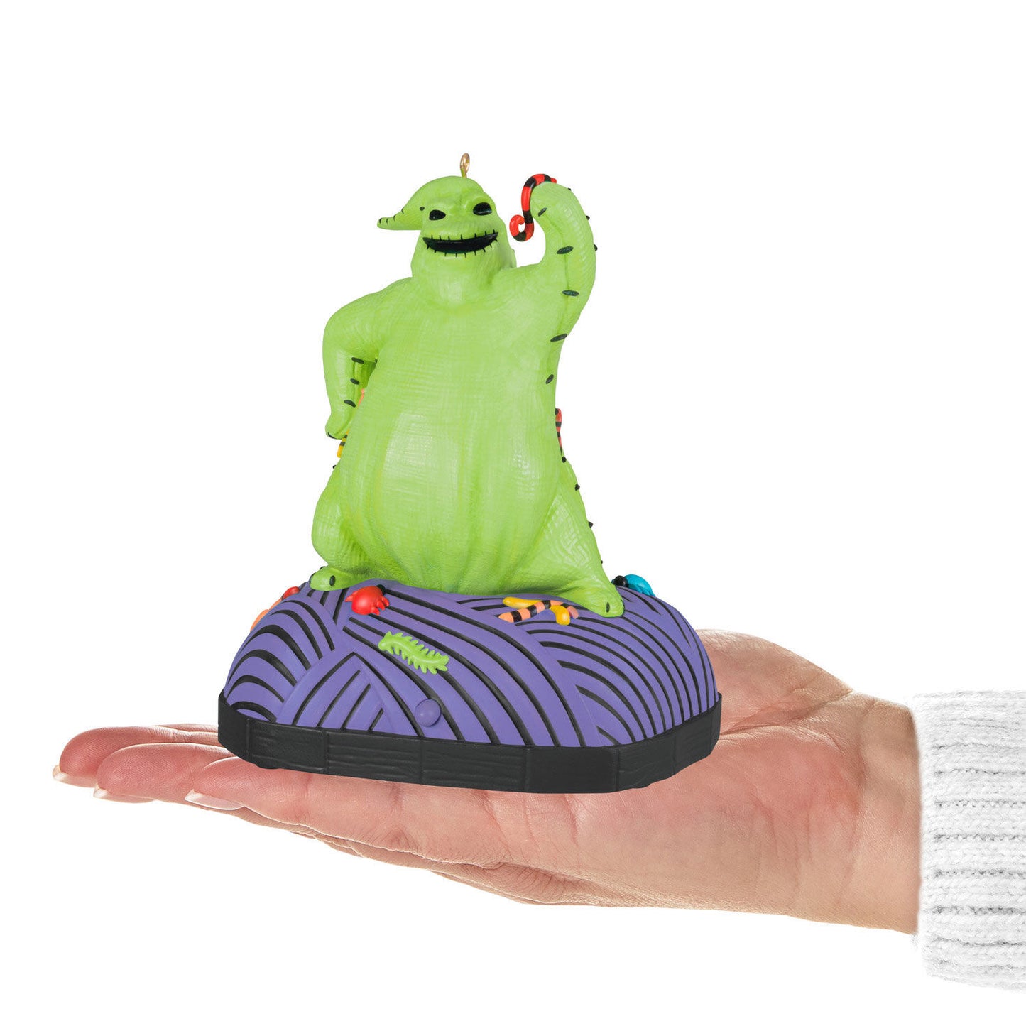 Disney Tim Burton's The Nightmare Before Christmas, Oogie Boogie With Sound and Motion — Hallmark Keepsake Christmas Ornament in hand, showcasing vibrant green colour and playful design.