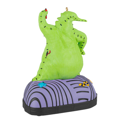 Disney Tim Burton's The Nightmare Before Christmas, Oogie Boogie With Sound and Motion — Hallmark Keepsake Christmas Ornament, close up view of vibrant green figurine with purple base.