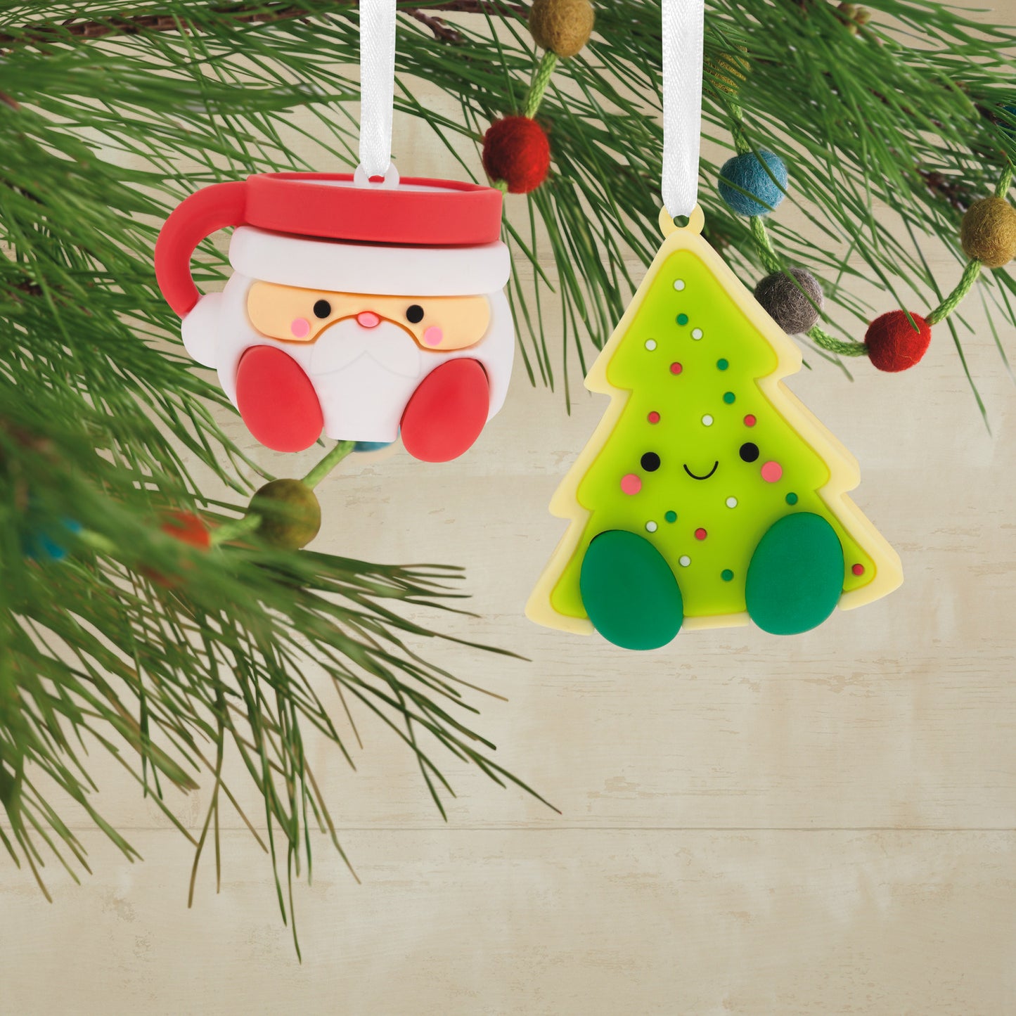 Better Together Santa Milk Mug and Christmas Tree Cookie Magnetic, shatterproof set of 2 with vibrant colours and cheerful designs hanging on a festive tree.