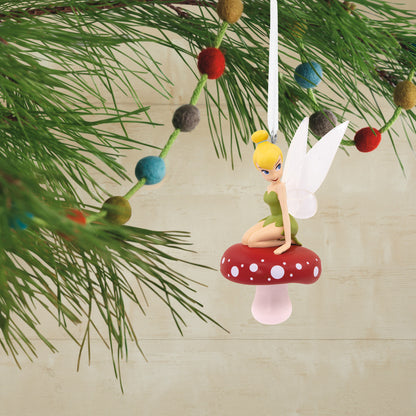 Hallmark Christmas Ornament - Disney Tinker Bell on Mushroom decorated with a red-and-white mushroom, hanging from a pine branch