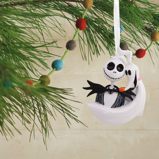 Hallmark Christmas Ornament - Disney Tim Burton's The Nightmare Before Christmas Jack Skellington and Zero hanging on a festive tree branch with colourful decorations.