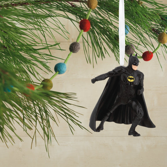 Hallmark Christmas Ornament - DC The Flash Batman; detailed view of Batman ornament hanging from a pine branch.