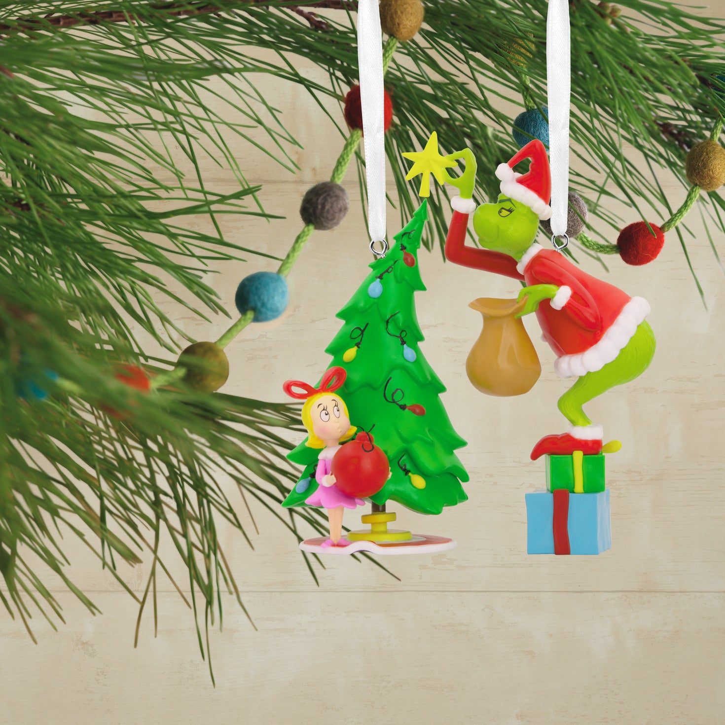 Hallmark Christmas Ornaments - Dr. Seuss's How the Grinch Stole Christmas! Grinch and Cindy-Lou Who, Set of 2, hanging by satin ribbons with festive tree.