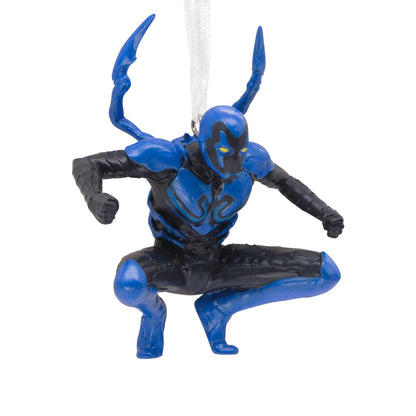 Hallmark Christmas ornament (DC Blue Beetle) featuring a detailed blue and black action figure design in a dynamic pose.