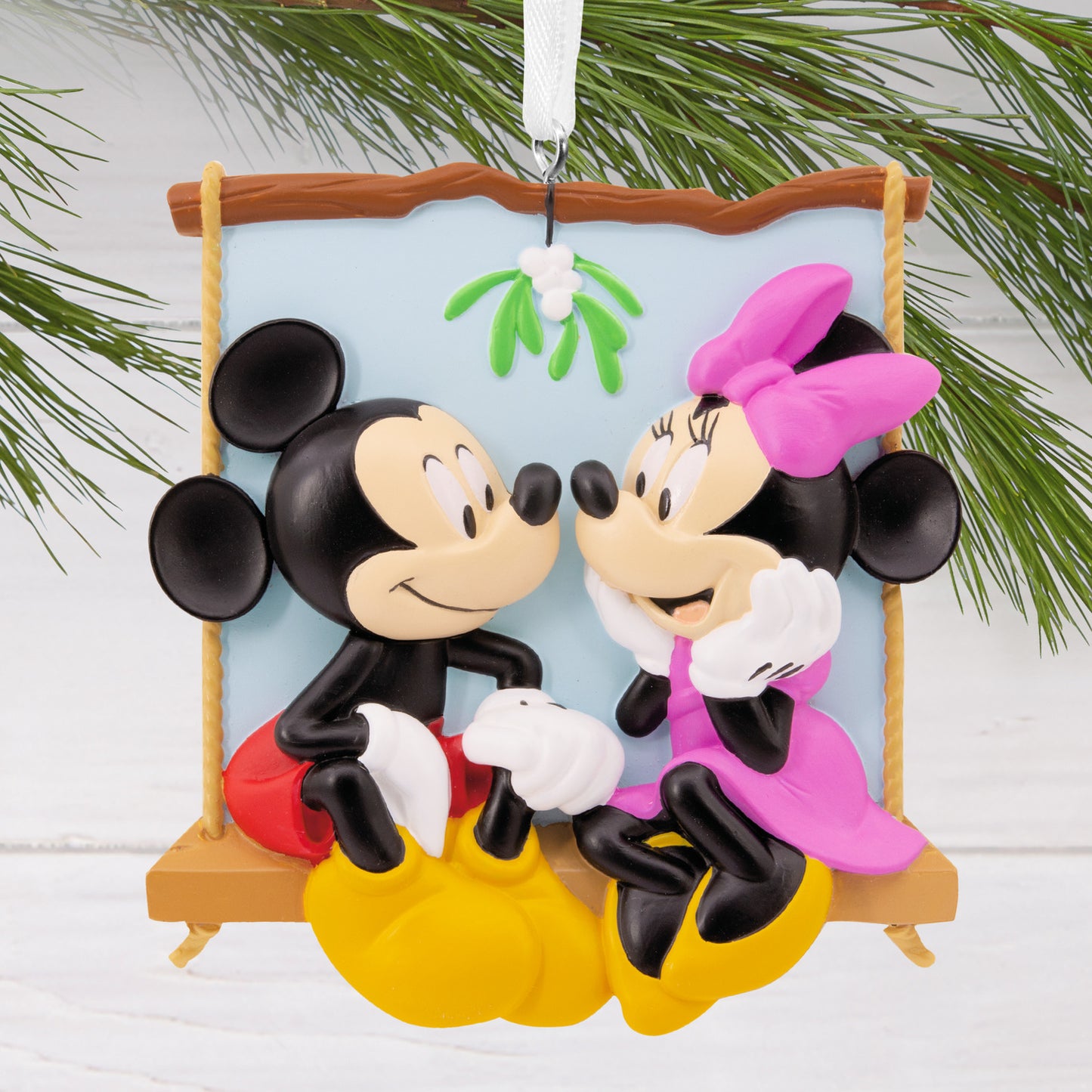 Hallmark Christmas ornament - Disney Mickey and Minnie on swing, colourful design with mistletoe, detailed close up view